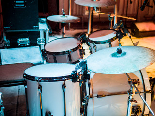 Fototapeta na wymiar Snow on the drum set. Winter concert on the stage in the open.