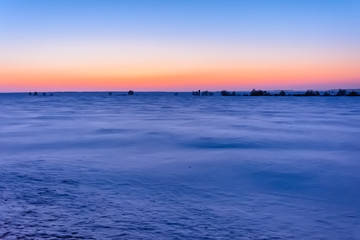 Sunrise in winter in the field