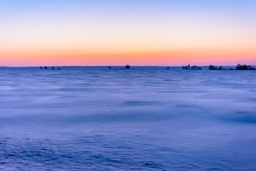 Obraz premium Sunrise in winter in the field