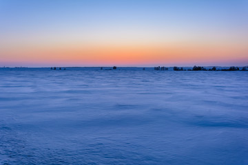 Obraz premium Sunrise in winter in the field