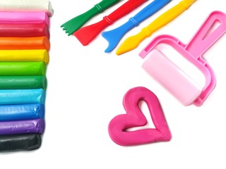 Colorful sticks with pink heart are plasticine clay and variety playing equipment, children can use this molding in various dough shapes along imaginative, multicolored line