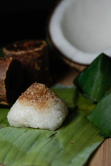 Pulut Inti. Savory glutinous rice with sweetened grated coconut wrapped in banana leaf. 