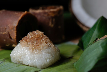 Pulut Inti. Savory glutinous rice with sweetened grated coconut wrapped in banana leaf. 