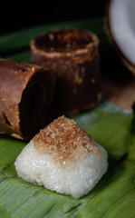 Pulut Inti. Savory glutinous rice with sweetened grated coconut wrapped in banana leaf. 