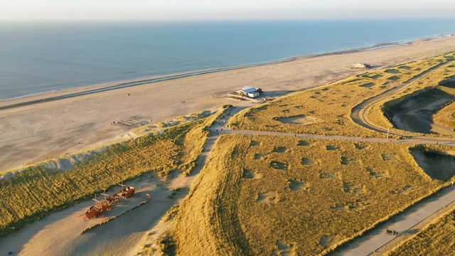 People walking on the beatch - Dutch coastline Hondsbossche seawall