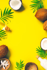 Bright yellow tropical background with coconut milk