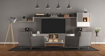 Minimalist gray room with home cinema system