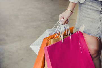 hand on holding shopping bags , she walking shopping