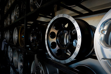 Obraz na płótnie Canvas Shelves with alloy wheels and tires in modern car service centre