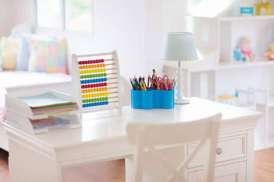 Kids Bedroom With Wooden Desk And Doll House.