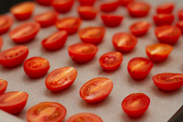 cherry tomatoes on parchment paper for baking