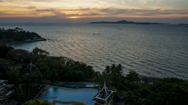 Amazing Thailand orange and pink sky sunset over Kho Larn Island off of Pattaya beach Thailand