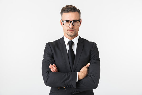 Handsome business man isolated over white wall background posing.