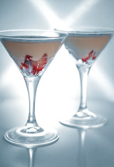Strawberry fromage dessert in coctail glasses and lighted with artificial light. Dessert and coctail concept.