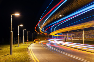 light trails of car on road at night. Traffic background