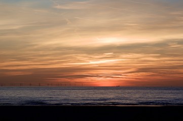 Fototapeta na wymiar Sunset on North Sea Shore in Netherlands