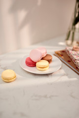 Hortensia bouquet with French macarons in sunlight. Female and lifestyle business and work from home concept.