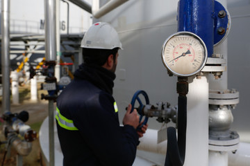 Pressure gauge at gas plant - measuring gas pressure - pipe and valve