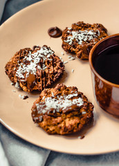 Tasty homemade Christmas cookies with chocolate and coconut, closeup. Selective focus.