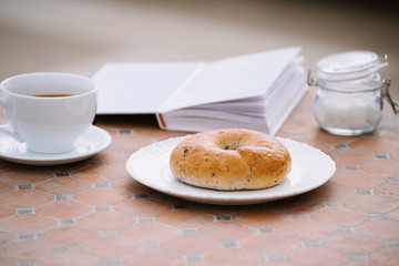 coffee, a good book and bread for a good morning in cafeteria