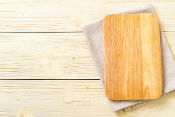 Fototapeta na wymiar empty cutting wooden board with kitchen cloth