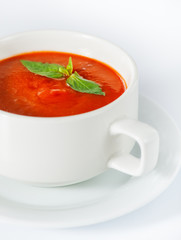 Delicious red tomato soup on white
