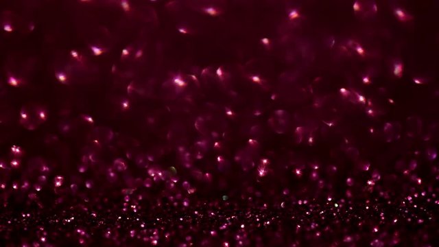 Scarlet glitter magic background. Defocused light and free focused place for your design.