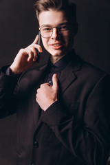 Handsome businessman speaking on mobile phone in office - Image