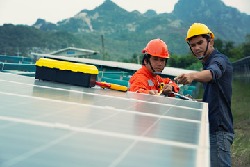 Electrical engineers are installing solar panels. To produce electricity from sunlight.