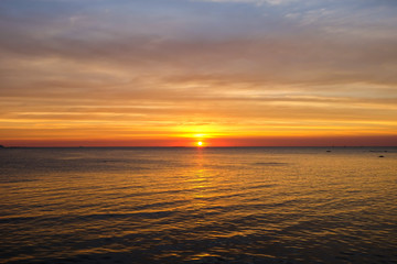 Naklejka na ściany i meble Sunset twilight at sea (Pattaya beach - Chonburi Thailand) for nature background or texture.