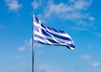 Greek flag waving in the sky