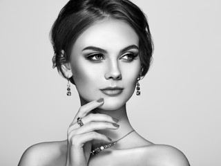 Portrait Beautiful Woman with Jewelry. Model Girl with Magnificent Manicure on Nails. Elegant...