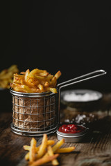 French fries in a basket with ketchup