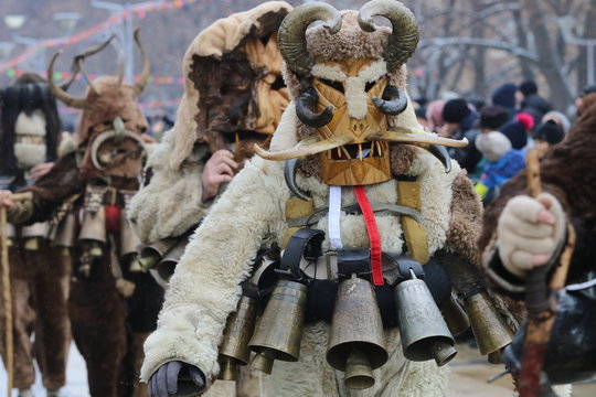 Pernik, Bulgaria - January 27, 2019 - Masquerade festival Surva in Pernik, Bulgaria. People with mask called Kukeri dance and perform to scare the evil spirits.