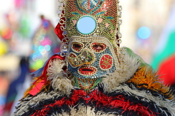 Pernik, Bulgaria - January 27, 2019 - Masquerade festival Surva in Pernik, Bulgaria. People with mask called Kukeri dance and perform to scare the evil spirits.