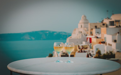 romantic vacation in Greece -two wine glasses in Santorini