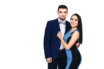 young happy stylish couple in blue clothes posing on white background