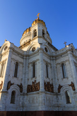Fototapeta na wymiar Bell tower of Cathedral of Christ the Saviour in Moscow against blue sky