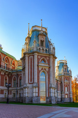 Fragment of Grand palace in Tsaritsyno park in Moscow against blue sky at sunny autumn day