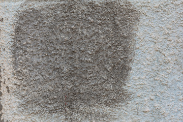 Concrete wall with a dark spot