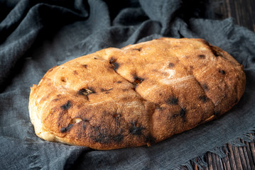 A loaf of fresh homemade bread on the table.