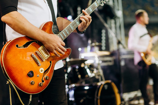 rock musician guitar player stage performance band