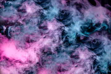 Beautiful pattern of smoke on a black background from the evaporating waves in the neon light of pink blue and purple as sea pebbles in the foam for T-shirt.