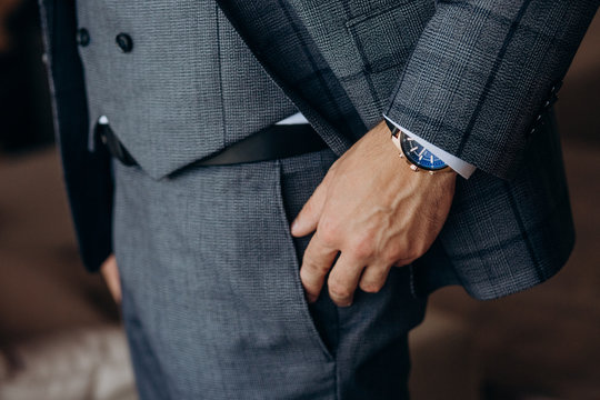 man gray suit with accessories holiday