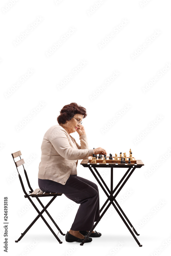 Poster senior woman with a chessboard at a table looking at the chess figure and thinking