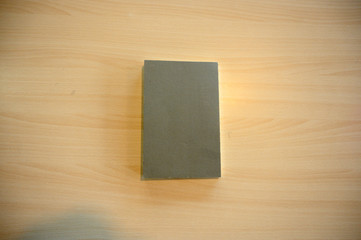 Grey book on the wood table