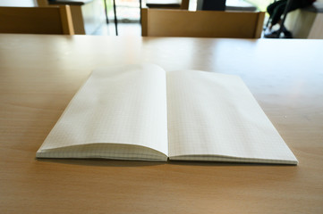 Grid book on the wood table