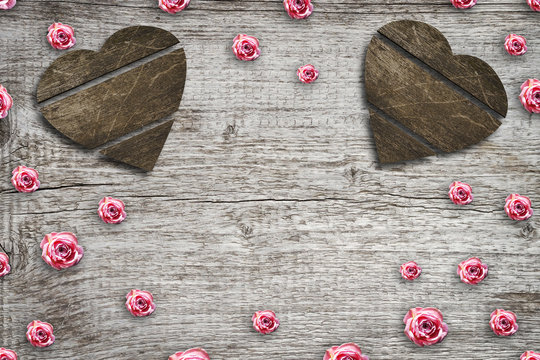 Buds of pink roses on a gray wooden background. Copy space. St. Valentine's Day, Mother's Day background.