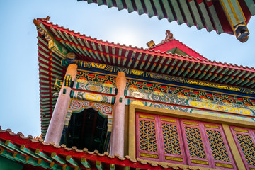 Fototapeta na wymiar Roof detail of Chinese Temple texture background. Beautiful Chinese temple roof detail with colorful architectural work at Wat Leng Nei Yi 2, Nonthaburi, Thailand