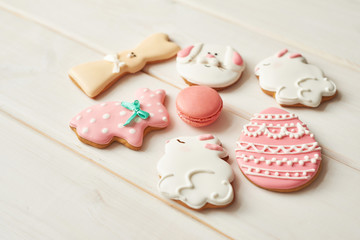 Closeup of colorful easter cookies on white background. Easter Postcard Template. Cookies in shape of eggs and Easter bunny. Happy Easter holiday background concept.Sweets for celebrate 
